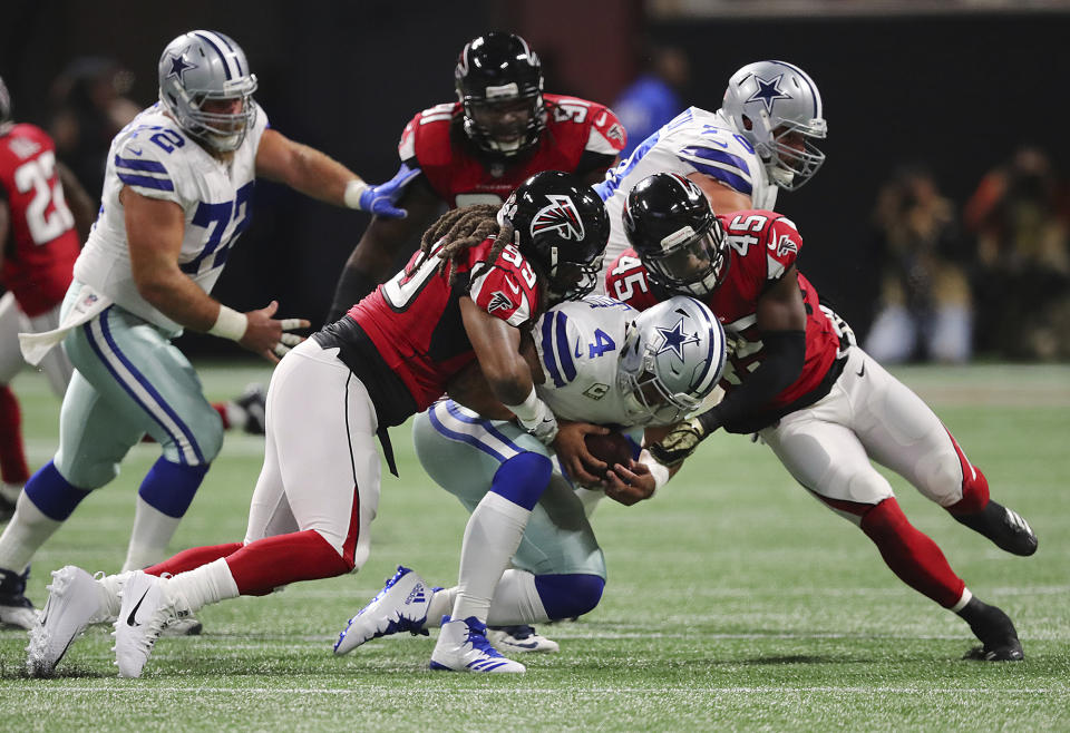 Falcons defensive end Adrian Clayborn (L) was credited with six sacks of Dallas’ Dak Prescott on Sunday. (AP)