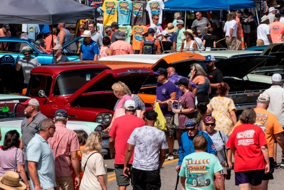Spectators walk among classic cars in downtown Biloxi during the Biloxi Block Party, one of many Cruisin’ the Coast events, on Wednesday, Oct. 4, 2023. Nearly 10,000 vehicles are registered for 2023’s Cruising’ the Coast. Hannah Ruhoff/Sun Herald
