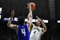 Purdue forward Trey Kaufman-Renn (4) shoots over New Orleans forward Omarion Henry (4) during the second half of an NCAA college basketball game in West Lafayette, Ind., Wednesday, Dec. 21, 2022. (AP Photo/Michael Conroy)