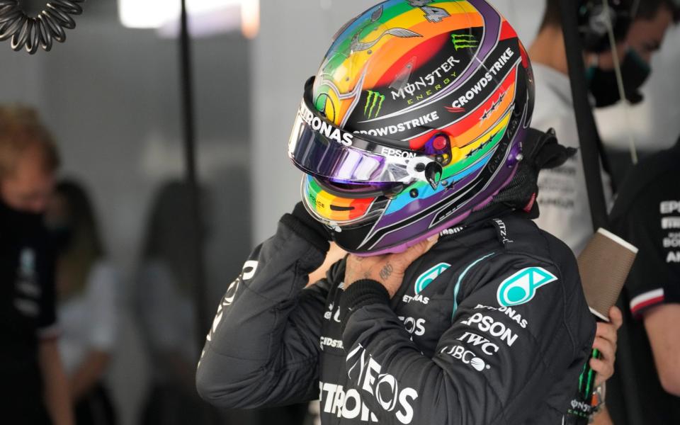 Mercedes driver Lewis Hamilton of Britain wears a new rainbow helmet during practice session in Lusail, Qatar, Saturday, Nov. 20, 2021 ahead of the Qatar Formula One Grand Prix - AP