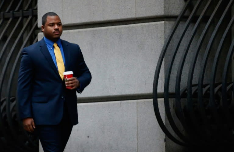 William Porter, one of six Baltimore city police officers charged in connection to the death of Freddie Gray, walks to a courthouse for jury selection in his trial on November 30, 2015 in Baltimore, Maryland