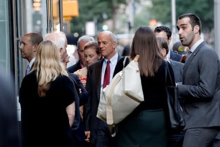 People stand outside the Le Cirque restaurant as they arrive for a fundraising event for Republican presidential candidate Donald Trump in Manhattan, New York City, U.S., June 21, 2016. REUTERS/Mike Segar