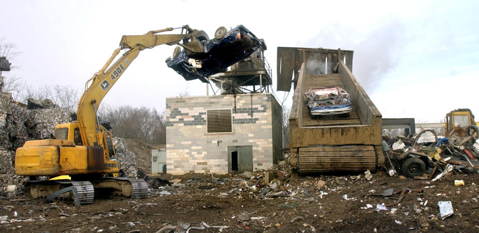 In this file photo, a crushed car is lifted onto the conveyor belt of the "shredder" at J&K Salvage on Kings Mill Road.