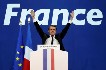 Emmanuel Macron, head of the political movement En Marche !, or Onwards !, and candidate for the 2017 French presidential election, celebrates after partial results in the first round of 2017 French presidential election, at the Parc des Expositions hall in Paris, France April 23, 2017. REUTERS/Benoit Tessier