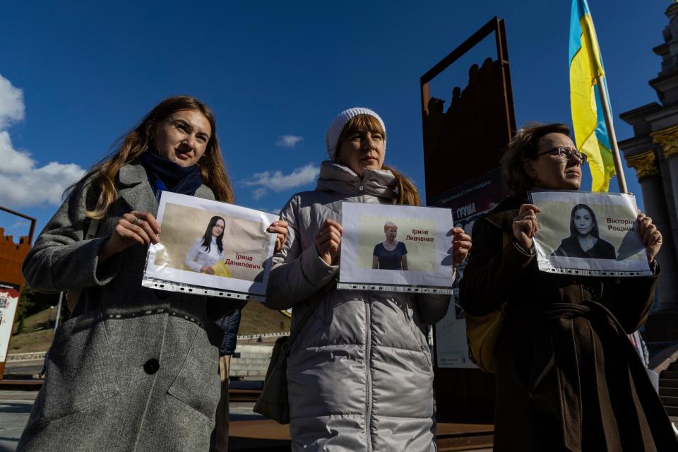 Members of the National Union of Journalists of Ukraine hold posters with portraits of three journalists imprisoned by Russia (Copyright 2023 The Associated Press. All rights reserved.)