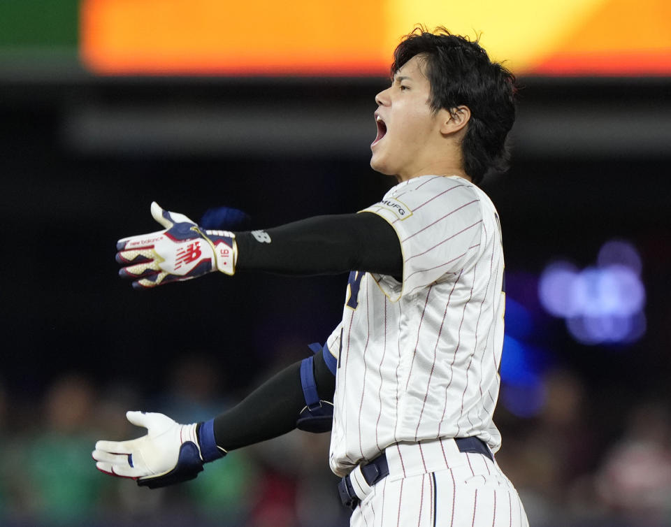 Japan's Shohei Ohtani celebrates after a double during the ninth inning of a World Baseball Classic game against Mexico, Monday, March 20, 2023, in Miami. (AP Photo/Wilfredo Lee)