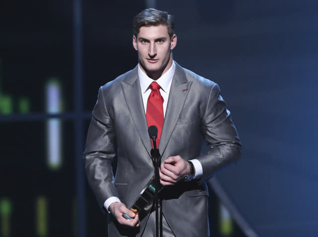 Joey Bosa of the Los Angeles Chargers accepts the award for AP Defensive Rookie of the Year at the 6th annual NFL Honors at the Wortham Center on Saturday, Feb. 4, 2017, in Houston. (Photo by John Salangsang/Invision for NFL via AP)
