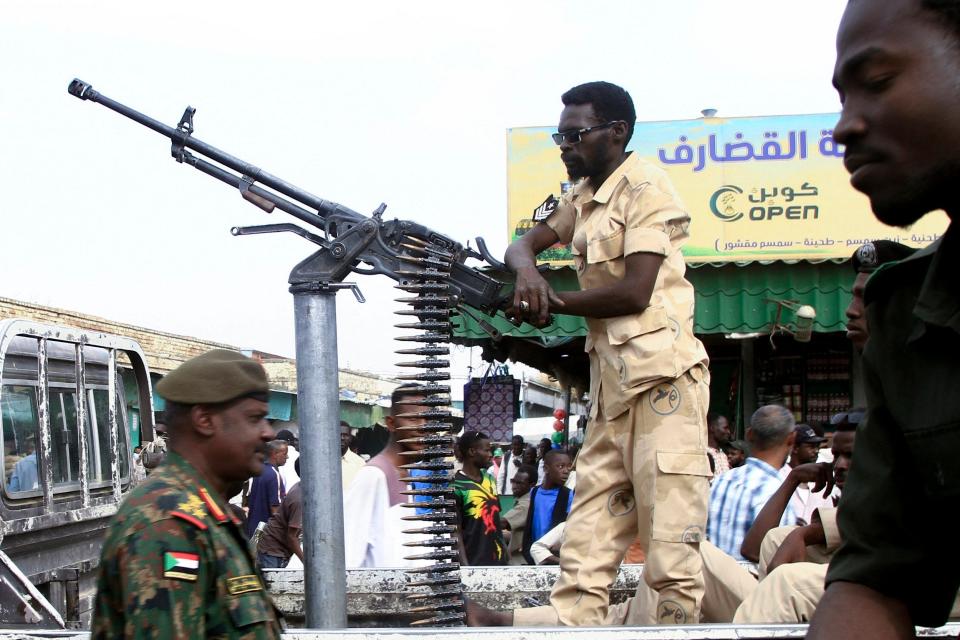 Sudanese security forces patrol in a commercial district in Gedaref city in eastern Sudan