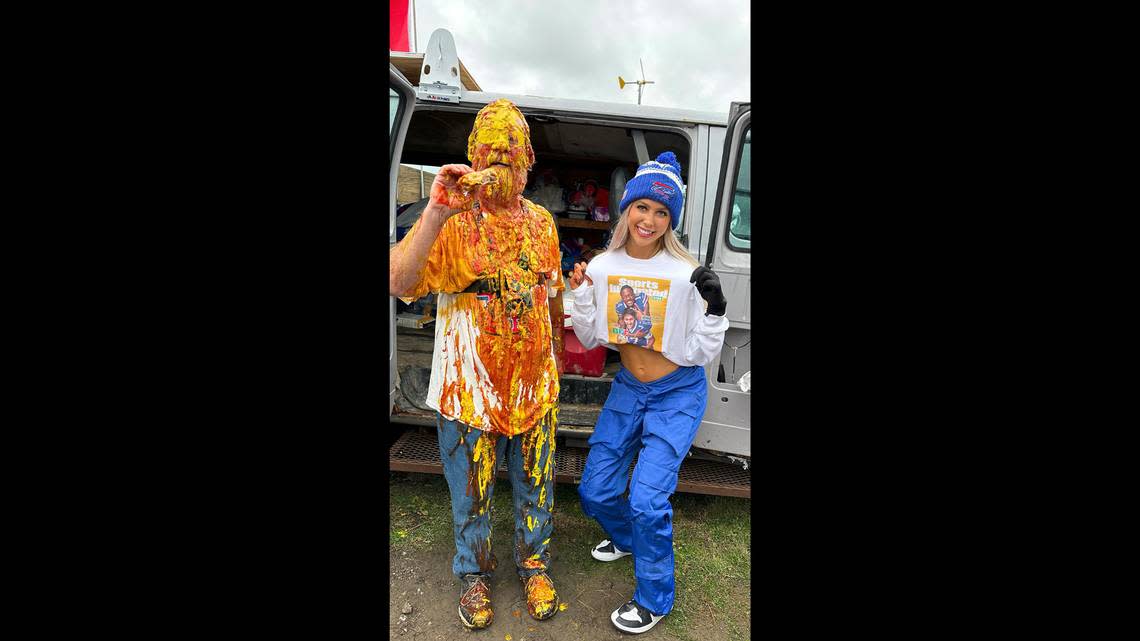 Lacey Jane Brown took time for a photo with a ketchup and mustard-covered Buffalo Bills fan.