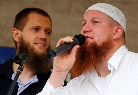 Islamic preachers Pierre Vogel (R) and Sven Lau from Germany talk to their supporters during the "Islamic Peace Congress" in Frankfurt, September 7, 2013. REUTERS/Kai Pfaffenbach