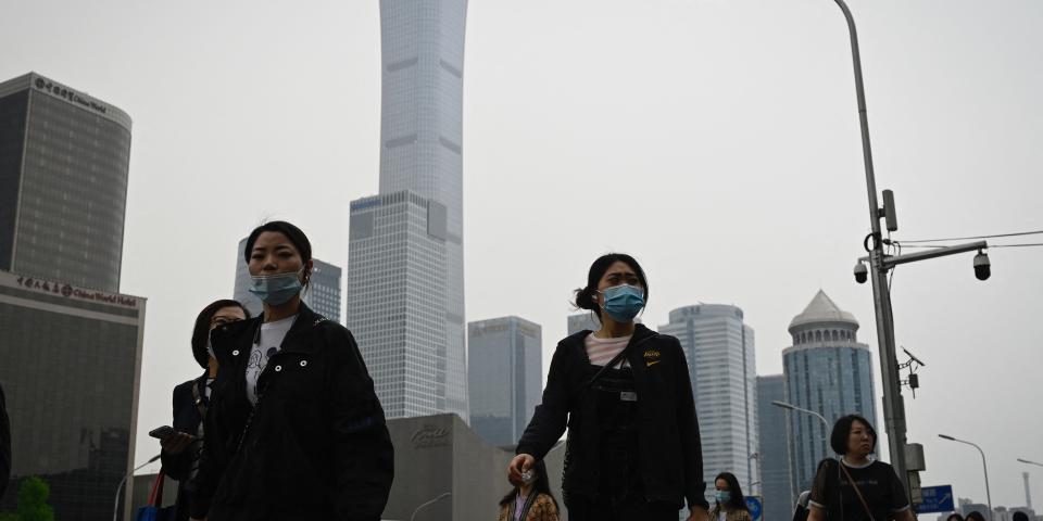 People are commuting in Beijing, China.