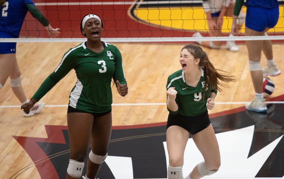 Tekoa Barnes and Mia Azevedo of Boca Raton Christian celebrate a point in the FHSAA Class 2A volleyball state championship on Saturday, Nov. 12, 2022, at Polk State College in Winter Haven.