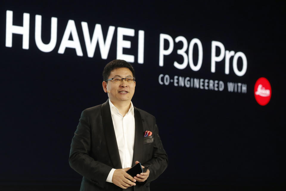 Huawei CEO Richard Yu displays the new Huawei P30 smartphone during a presentation, in Paris, Tuesday, March 26, 2019. (AP Photo/Thibault Camus)
