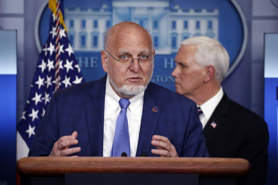 Dr. Robert Redfield, director of the Centers for Disease Control and Prevention, speaks about the coronavirus in the James Brady Press Briefing Room of the White House, Wednesday, April 8, 2020, in Washington, as Vice President Mike Pence watches. (AP Photo/Alex Brandon)