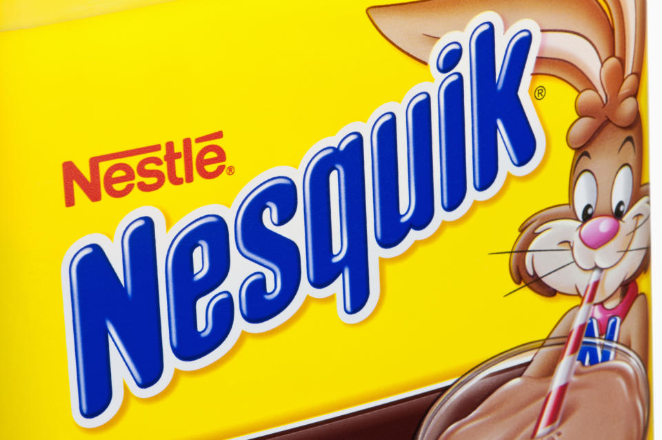 Minneapolis, Minnesota - July 9, 2011: Nestle Nesquik Container.  A close-up view of a Nestle Nesquik container with the classic yellow and blue label.  Nestle is the largest food and nutrition company in the world with headquarters in Vevey, Switzerland.  Nesquik has been America\'s #1 flavored milk for over 50 years.