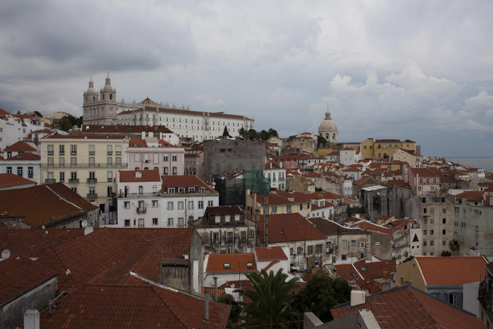 In this Sept. 28, 2012 photo, view of Lisbon's Alfama neighborhood. Portugal is scrapping its long-standing rent controls in one of the government's most radical economic and social reforms since the ailing country needed a euro 78 billion bailout last year, when it was engulfed by Europe's financial crisis. Critics say the anticipated rent hikes from next month could price thousands of families out of their homes. At the very least, the change aimed at boosting and modernizing the economy, will add to the financial burden on those struggling to cope with pay cuts and tax hikes designed to ease the country's crippling debt load. (AP Photo/Armando Franca)