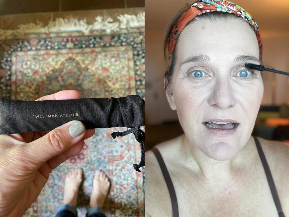 The writer holds a tube of mascara in a black pouch that says "Westman Atelier"; the writer runs mascara on her lashes