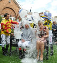 Jockey Frankie Dettori and television presenter Clare Balding take part in the 'Ice Bucket Challenge' in aid of motor neurone disease on Coolmore Nunthorpe Stakes Day during Day Three of the 2014 Welcome To Yorkshire Ebor Festival at York Racecourse, York.