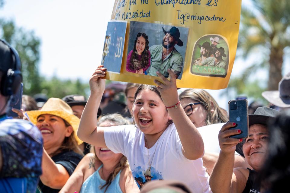 Miya Cadena, 10 of Thousand Palms watches Mexican superstar Carín León during the Key to the City Ceremony outside the Coachella Library in Coachella, Calif., on Saturday, April 20, 2024. Cadena and her mom arrived at 6 a.m. to get a spot up front for the event that took place around noon.