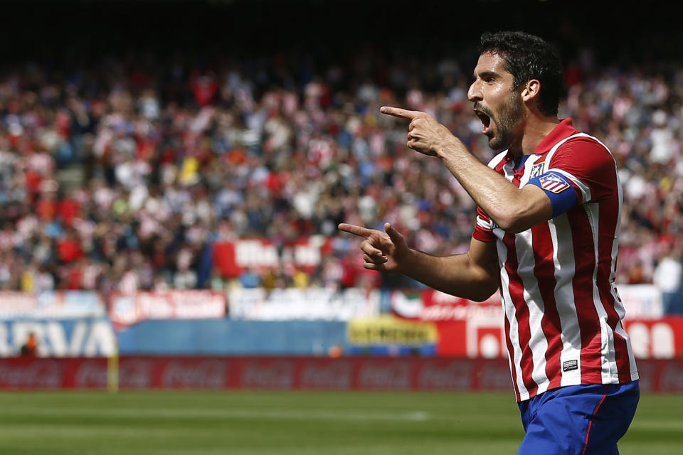 Atletico's Raul Garcia celebrates his goal during a Spanish La Liga soccer match between Atletico Madrid and Villarreal at the Vicente Calderon stadium in Madrid, Spain, Saturday, April 5, 2014. (AP Photo/Andres Kudacki)