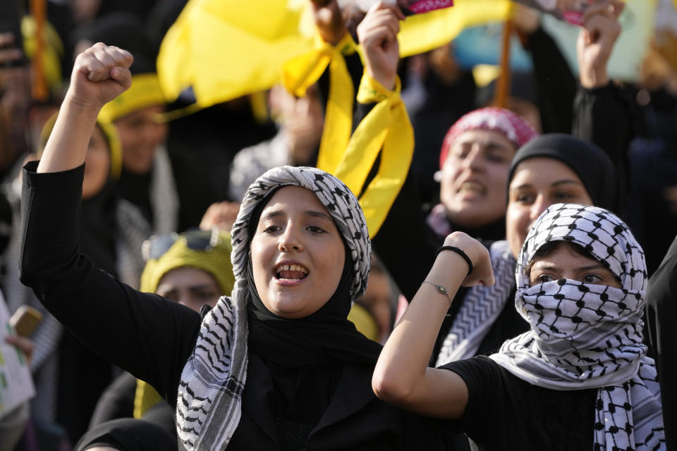 Supporters of the Iranian-backed Hezbollah group shout slogans, as they wait the speech of Hezbollah leader Sayyed Hassan Nasrallah, during a rally to commemorate Hezbollah fighters who were killed in South Lebanon last few weeks while fighting against the Israeli forces, in Beirut, Lebanon, Friday, Nov. 3, 2023. Nasrallah's speech had been widely anticipated throughout the region as a sign of whether the Israel-Hamas conflict would spiral into a regional war. (AP Photo/Hussein Malla)