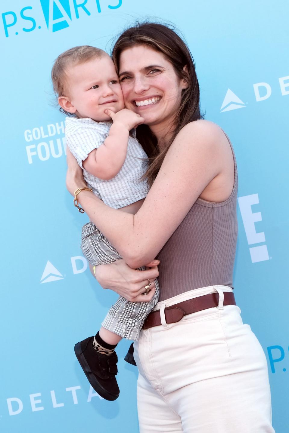 The <em>Bless This Mess</em> actress "felt very empowered" by her <a href="https://people.com/parents/lake-bell-opens-up-about-home-birth-with-son/" rel="nofollow noopener" target="_blank" data-ylk="slk:first home birth;elm:context_link;itc:0;sec:content-canvas" class="link ">first home birth</a>, which "was this amazing primal bonding" experience with daughter Nova, 5. "When my daughter came out, she had the [umbilical] cord wrapped around her neck, and it was very scary. She was on my chest and she wasn’t breathing. The midwife gave her three lifesaving breaths on my chest and my husband was there. She came to life and we saw it," Bell told costar Dax Shepard on his <em>Armchair Expert</em> podcast. Unfortunately,<a href="https://people.com/parents/lake-bell-opens-up-about-home-birth-with-son/" rel="nofollow noopener" target="_blank" data-ylk="slk:her second home birth in 2017 had further complications;elm:context_link;itc:0;sec:content-canvas" class="link "> her second home birth in 2017 had further complications</a>. It also resulted in the umbilical cord getting wrapped around her son Ozgood's neck, but unlike his older sister, "he was not coming to." "Now you’re in really f—ing life and death. Your child is there and the entire room is trying to resuscitate him and they can’t." Ultimately, he stayed in the NICU for 11 days, Bell shared: "Children's Hospital Los Angeles saved his life."