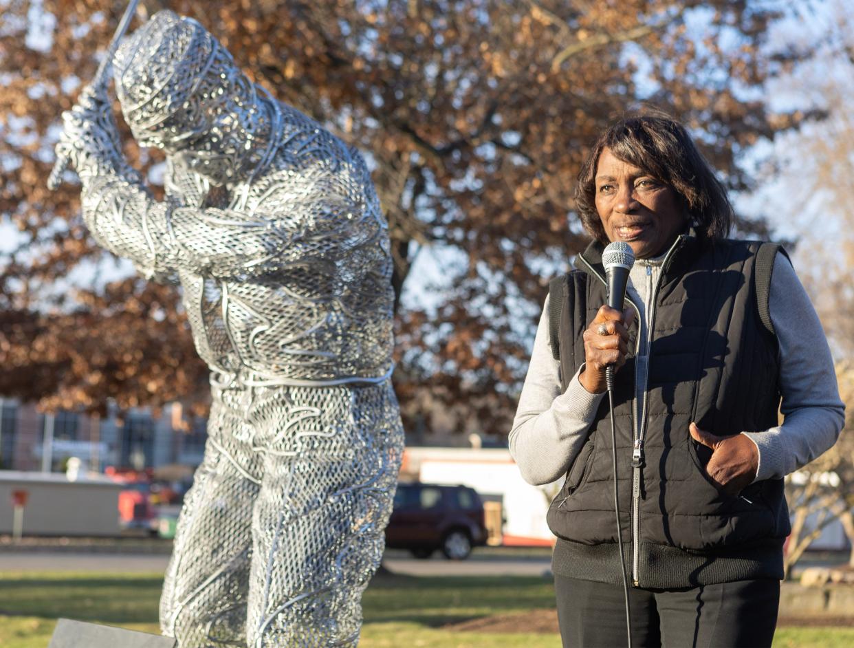 Renee Powell, daughter of Clearview Golf Course founder William J. Powell, speaks at the dedication of his statue outside the Minerva Public Library. In 1948, William Powell became the first Black American in the U.S. to design, build, and own a golf course.