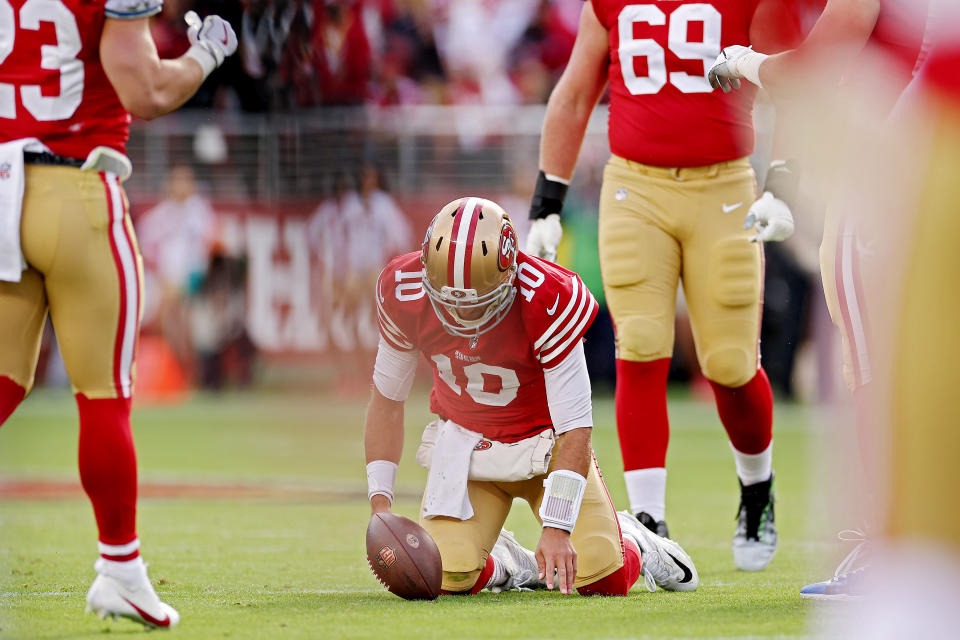 SANTA CLARA, CALIFORNIA - DECEMBER 04: Jimmy Garoppolo #10 of the San Francisco 49ers struggles to get up after being sacked during the first quarter against the Miami Dolphins at Levi's Stadium on December 04, 2022 in Santa Clara, California. (Photo by Ezra Shaw/Getty Images)