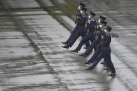 Hong Kong police show their new goose step marching style on the National Security Education Day at a police school in Hong Kong Thursday, April 15, 2021. Authorities in Hong Kong are marking the day with a police college open house, where police personnel demonstrated the Chinese military's "goose step" march, replacing British-style foot drills. The "goose step" march is one in which troops swing their legs off the ground in unison, keeping each leg straight. (AP Photo/Vincent Yu)