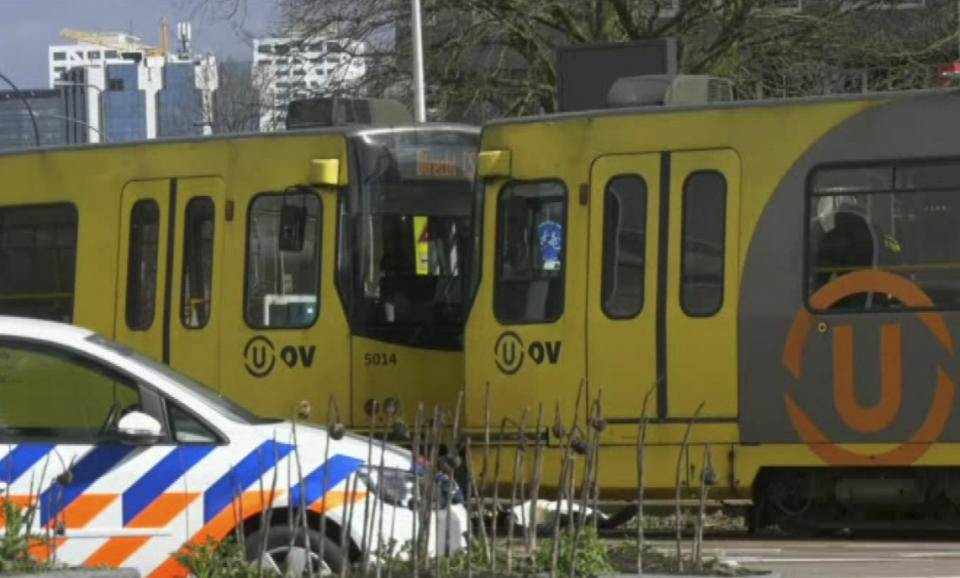In this image taken from video, a body lays next to a tram as emergency services attend the scene of a shooting in Utrecht, Netherlands, Monday March 18, 2019. (Photo: Peter Dejong/AP)