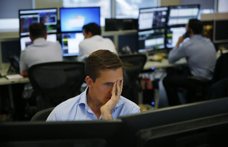 A risk manager works on the trading floor at IG Index in London, Britain August 25, 2015. REUTERS/Suzanne Plunkett