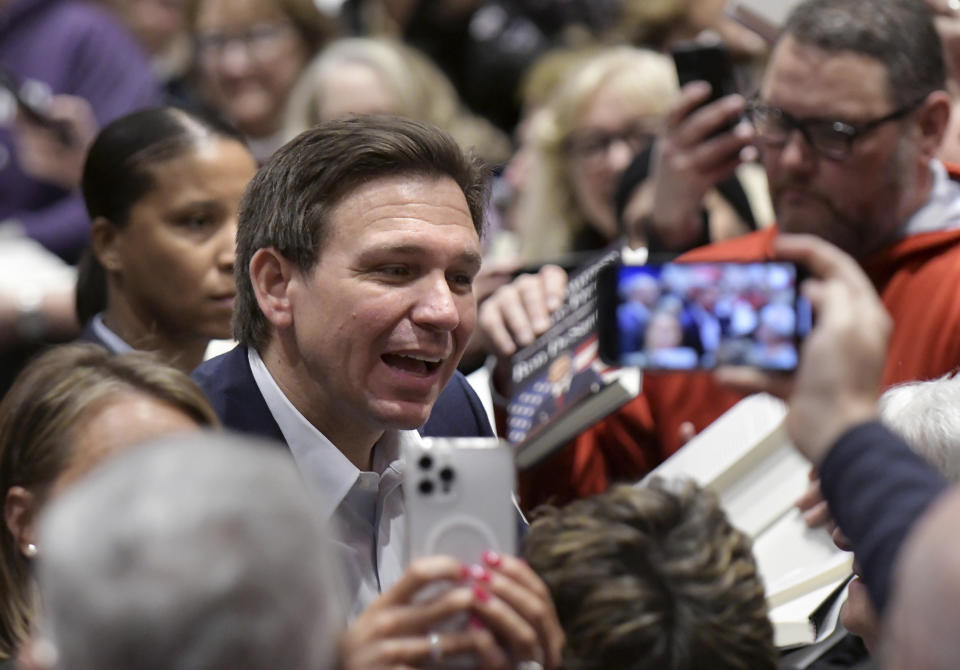 Florida Gov. Ron DeSantis greets people in the crowd during an event Friday, March 10, 2023, in Davenport, Iowa. (AP Photo/Ron Johnson)