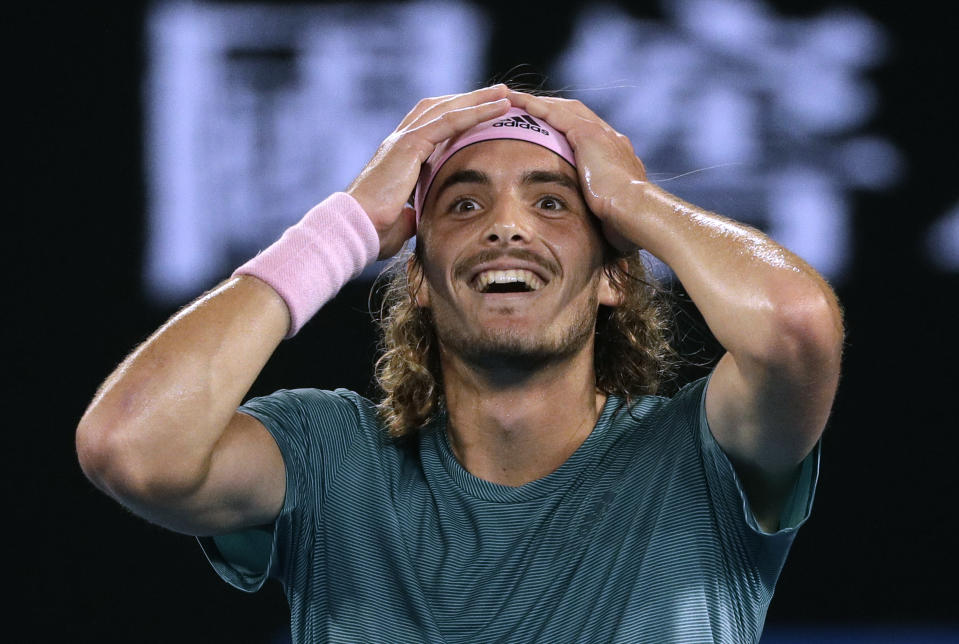 FILE - In this Jan. 20, 2019, file photo, Greece's Stefanos Tsitsipas celebrates after defeating Switzerland's Roger Federer in their fourth round match at the Australian Open tennis championships in Melbourne, Australia. Of particular interest is when a new face will emerge from the crop of 20-somethings who have been rising in the rankings. (AP Photo/Mark Schiefelbein, File)