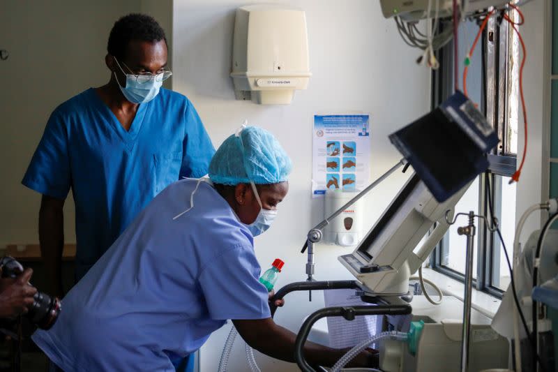 Medical staff members demonstrate how to activate a respirator as the hospital prepares for the coronavirus disease (COVID-19) outbreak, at the Karen hospital near Nairobi