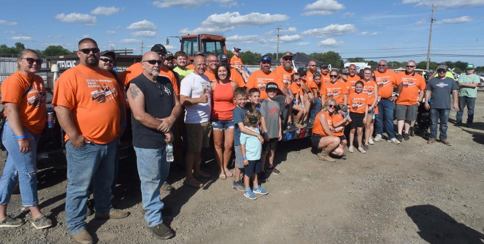Derby family and friends come together to support Craig Beaubien of Carleton at the Monroe County Fair Demolition Derby on Tuesday, August 2, 2022. Beaubien was diagnosed with stage IV kidney cancer three years ago.