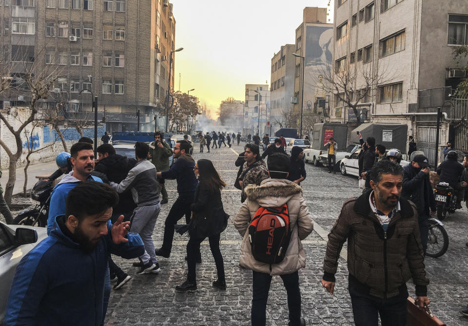 <p>In this photo taken by an individual not employed by the Associated Press and obtained by the AP outside of Iran, people are affected by tear gas fired by anti-riot Iranian police to disperse demonstrators in a protest over Iran’s weak economy, in Tehran, Iran, Saturday, Dec. 30, 2017. (Photo: AP) </p>