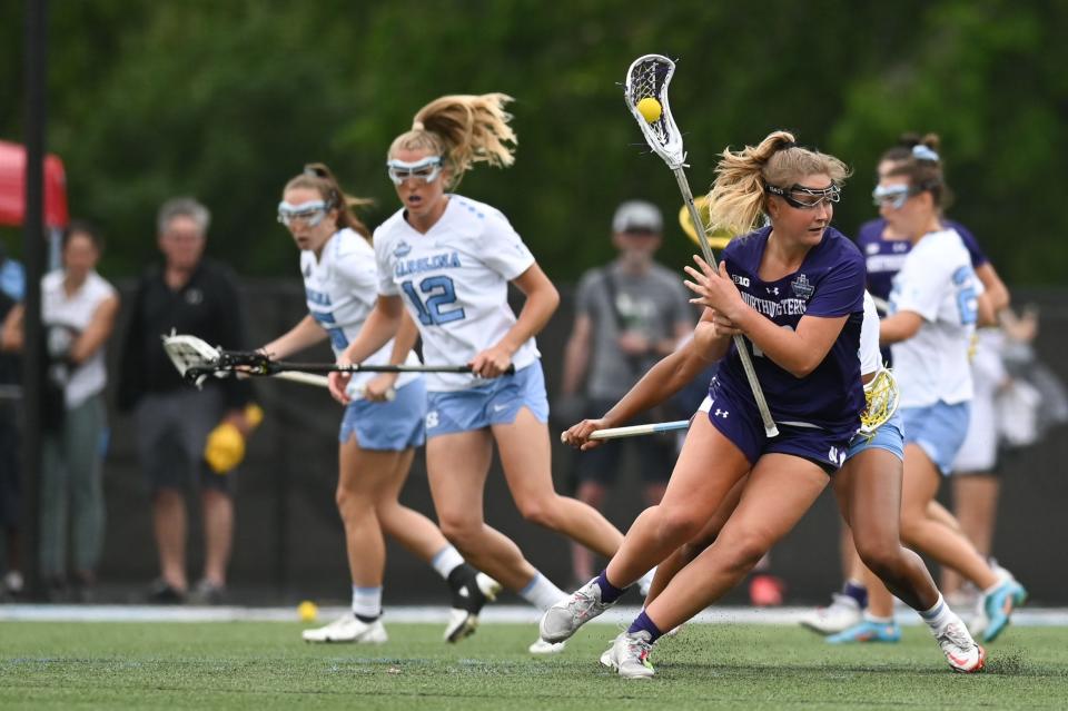 May 27, 2022; Baltimore, MD, USA;  Northwestern midfielder  Dylan Amonte (10) dodges on North Carolina defender/midfielder Brooklyn Walker-Welch (45) during the first half at Homewood Field. Mandatory Credit: Tommy Gilligan-USA TODAY Sports