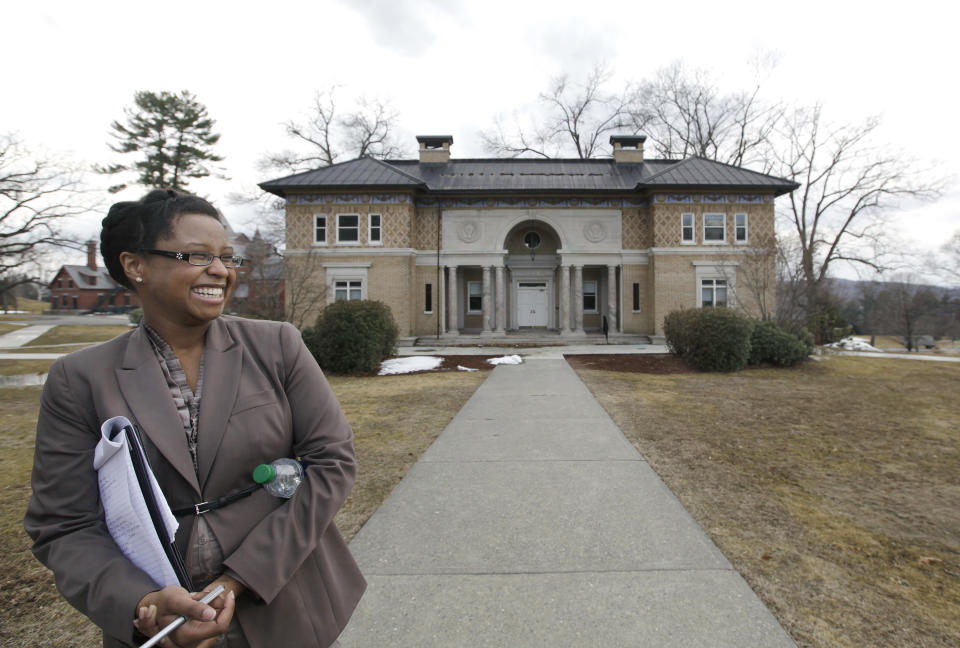 Tracy Davis, academic dean of Olivet University, laughs during a tour of an historic 217-acre campus in Northfield, Mass., in this photo taken Thursday, March 8, 2012. The campus, along with its 43 buildings, is being offered for free to an orthodox Christian group who can come up a solid plan to use it. (AP Photo/Elise Amendola)