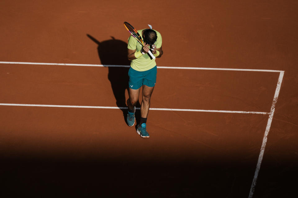 Spain's Rafael Nadal reacts after missing a shot against Canada's Felix Auger-Aliassime during their fourth round match at the French Open tennis tournament in Roland Garros stadium in Paris, France, Sunday, May 29, 2022. (AP Photo/Thibault Camus)