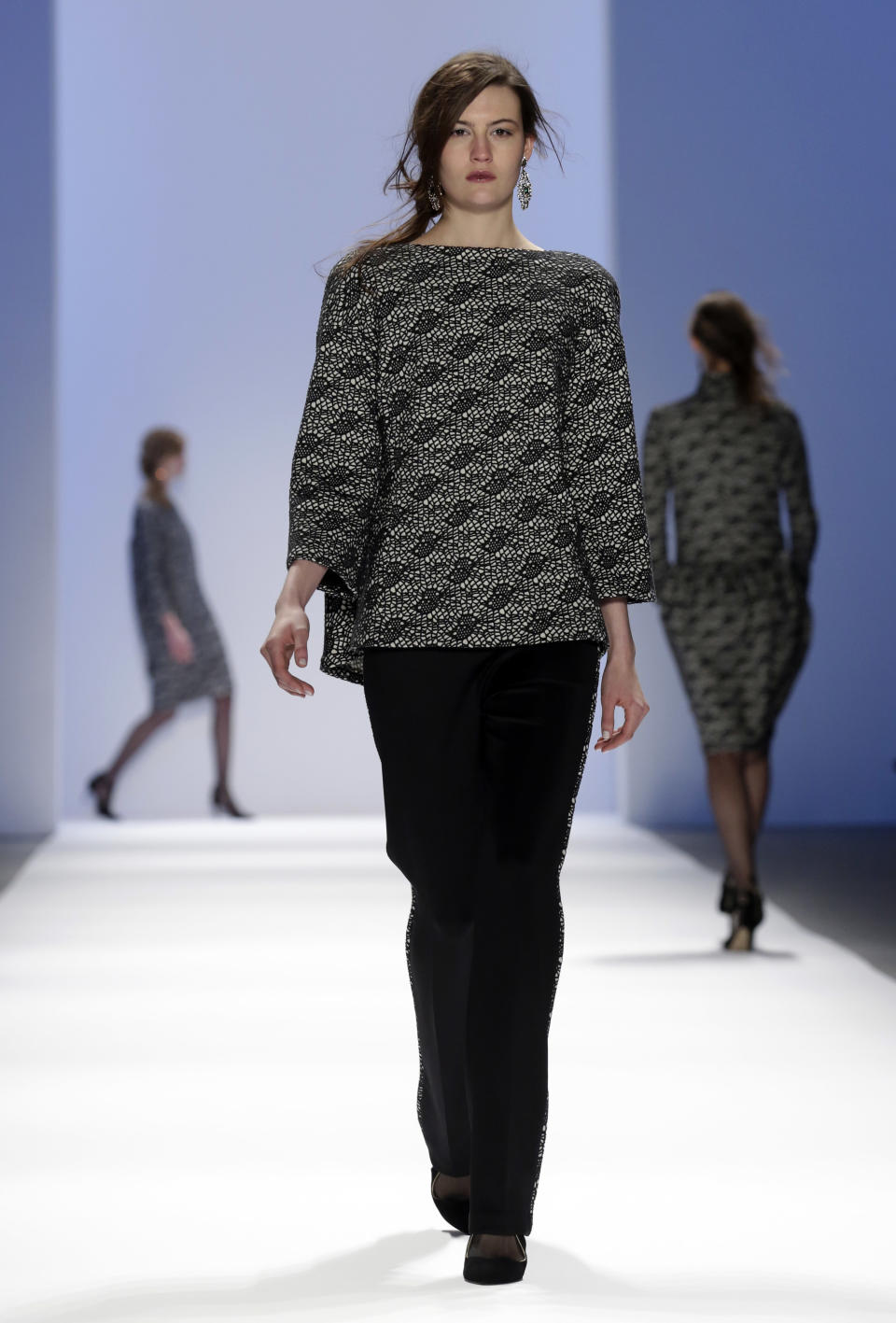 The Tadashi Shoji Fall 2013 collection is modeled during Fashion Week in New York on Thursday, Feb. 7, 2013. (AP Photo/Richard Drew)
