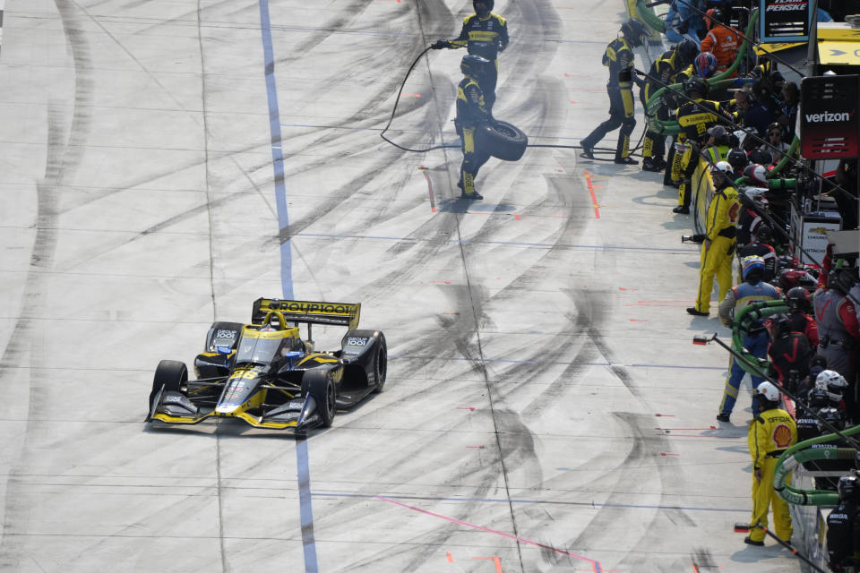 Colton Herta pulls out of the pits during the IndyCar Detroit Grand Prix auto race, Sunday, June 4, 2023, in Detroit. (AP Photo/Carlos Osorio)