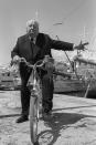 <p>Alfred Hitchcock rides a bicycle in the South of France in 1972. </p>