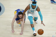 Charlotte Hornets' Devonte' Graham (4) and Indiana Pacers' T.J. McConnell (9) vie for a loose ball during the first half of an NBA basketball Eastern Conference play-in game Tuesday, May 18, 2021, in Indianapolis. (AP Photo/Darron Cummings)