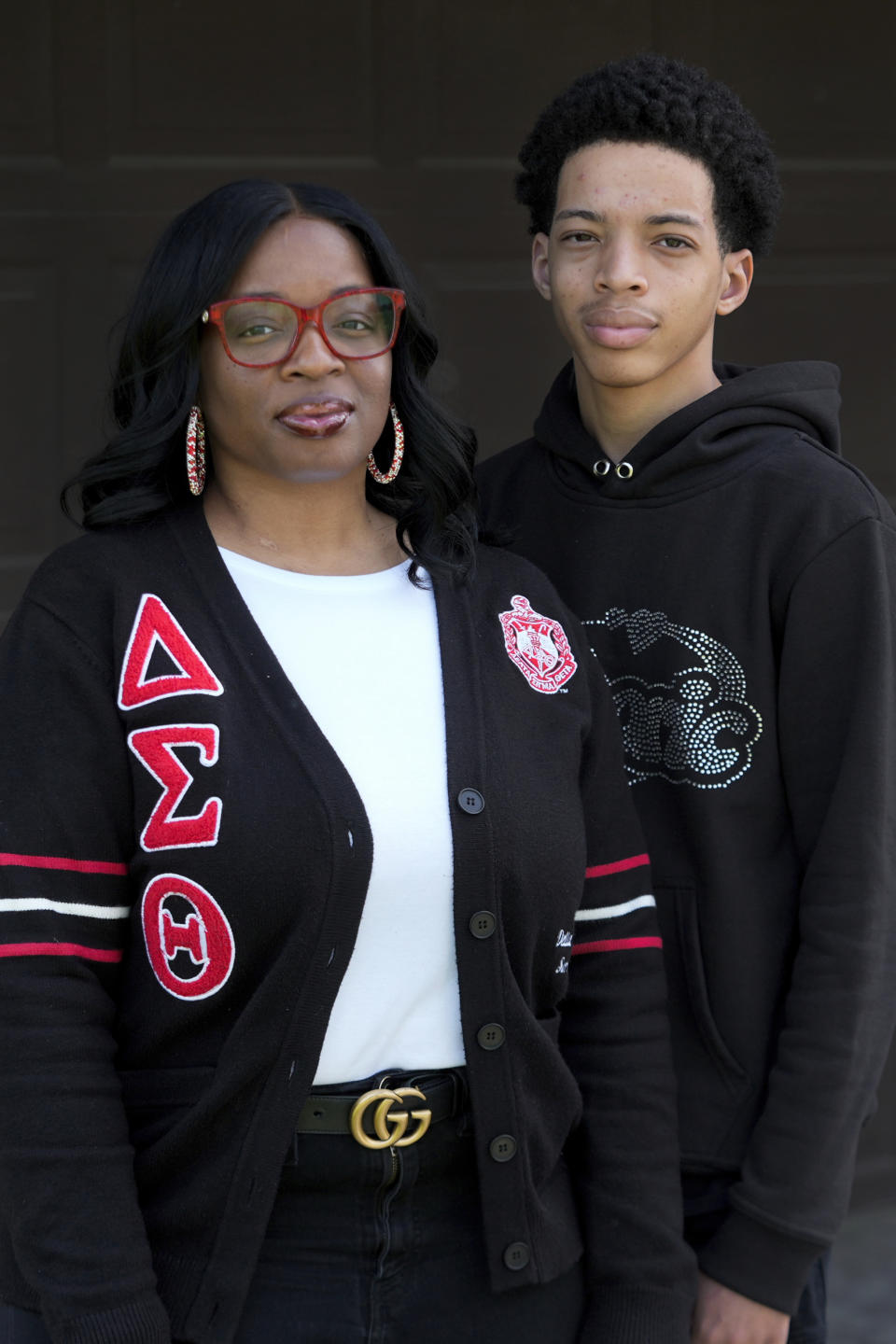 Denita Dorsey poses with her son Julian Morris, 16, in Saginaw, Mich., Thursday, May 16, 2024. (AP Photo/Paul Sancya)