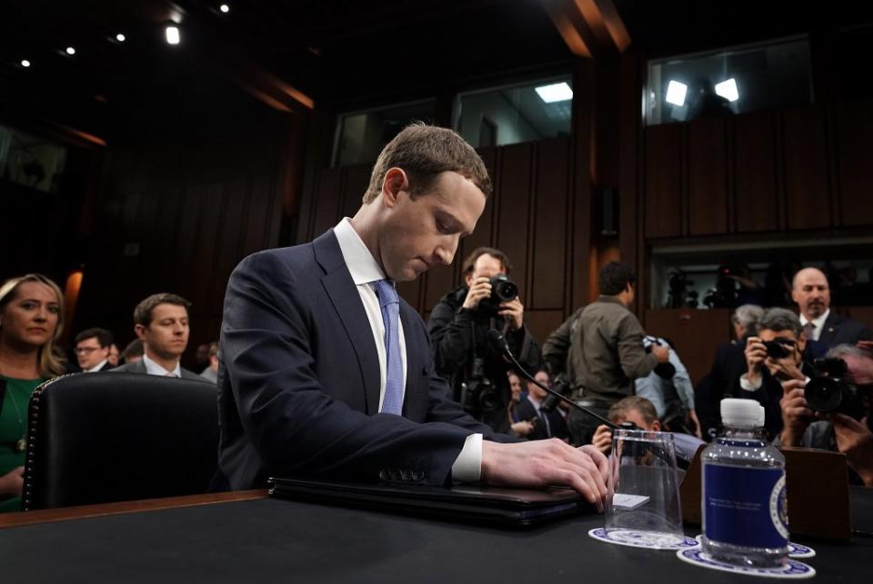 Facebook co-founder and CEO Mark Zuckerberg listens to questions from U.S. House Financial Services Committee member Rep. Alexandria Ocasio-Cortez, D-New York, and Rep. Jennifer Wexton, D-Virginia, during a hearing in the Rayburn House Office Building on Capitol Hill Oct. 23, 2019. in Washington, D,C.