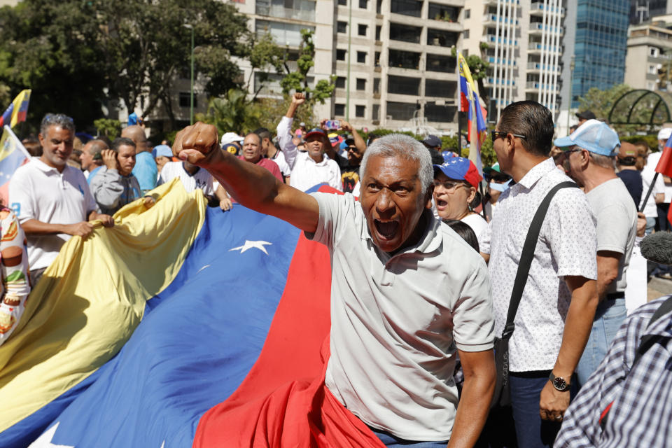 Supporters of opposition coalition presidential hopeful Maria Corina Machado attend her campaign event in Caracas, Venezuela, Tuesday, Jan. 23, 2024. An election date has not been set yet, when the opposition's one candidate, Machado, will run against current President Nicolas Maduro. (AP Photo/Jesus Vargas)