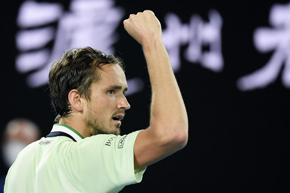 Daniil Medvedev of Russia reacts after winning the third set against Stefanos Tsitsipas of Greece during their semifinal match at the Australian Open tennis championships in Melbourne, Australia, Friday, Jan. 28, 2022 (AP Photo/Andy Brownbill)