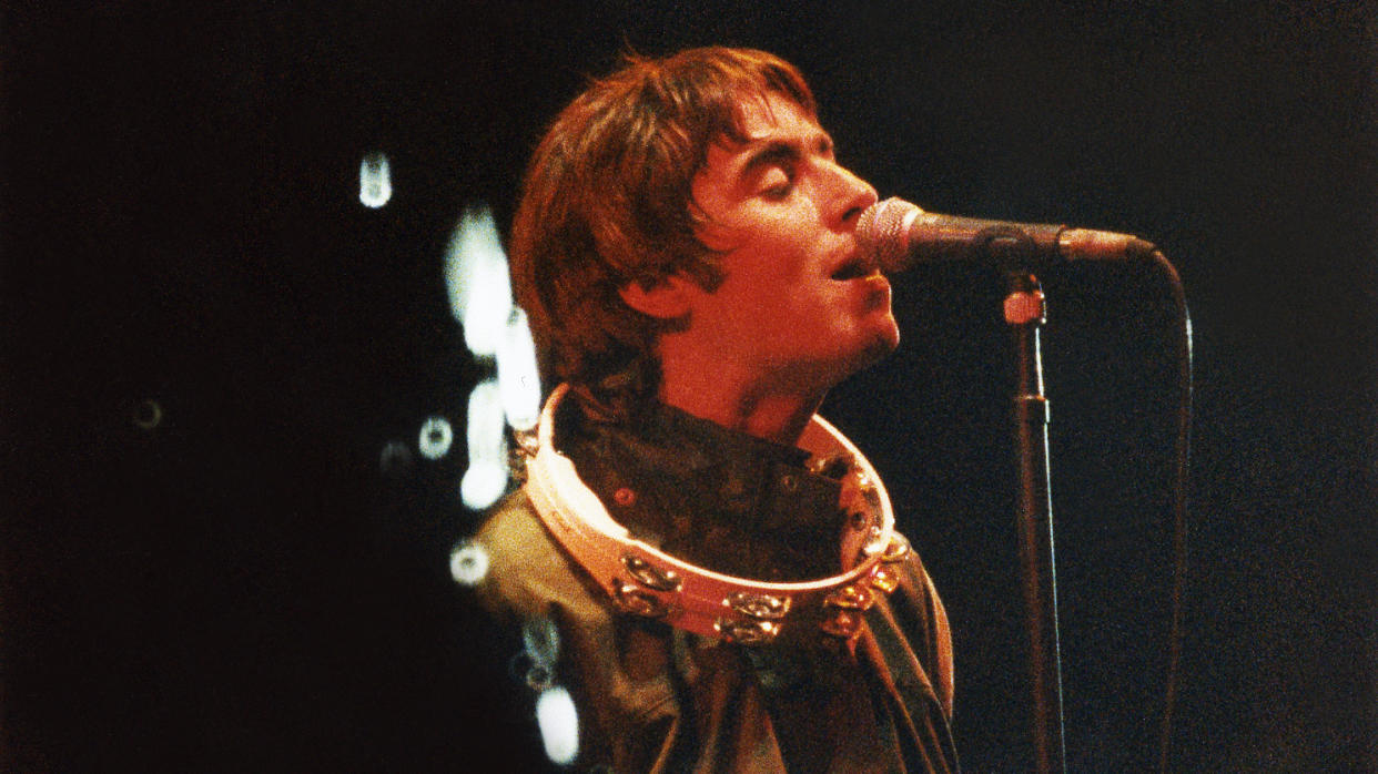 Liam Gallagher often used a tambourine on stage while performing with Oasis. (Pete Still/Redferns)