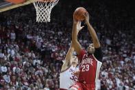 Ohio State's Zed Key (23) is fouled by Indiana's Trey Galloway (32) as he goes up for a dunk during the first half of an NCAA college basketball game, Saturday, Jan. 28, 2023, in Bloomington, Ind. (AP Photo/Darron Cummings)