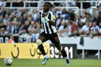 Newcastle's Allan Saint-Maximin controls the ball during the English Premier League soccer match between Newcastle United and Manchester City at St James Park in Newcastle, England, Sunday, Aug.21, 2022. (AP Photo/Rui Vieira)